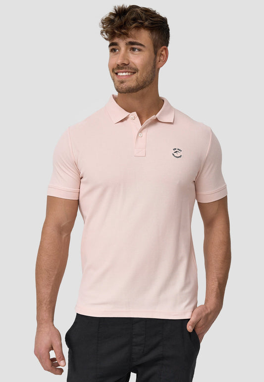 Polo rosa de manga corta.